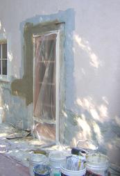 New door cut in stucco wall with Larsen WeldCrete primer